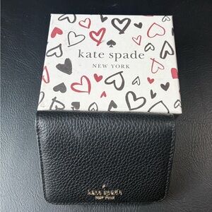 Kate Spade Black Leather Wallet
Holds credit cards and ID cards
Comes with box